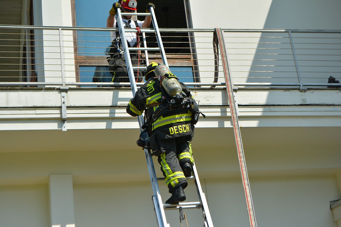 Lieutenant Brandon Desch climbs a ladder as part of the first step of the search and rescue training Thursday.