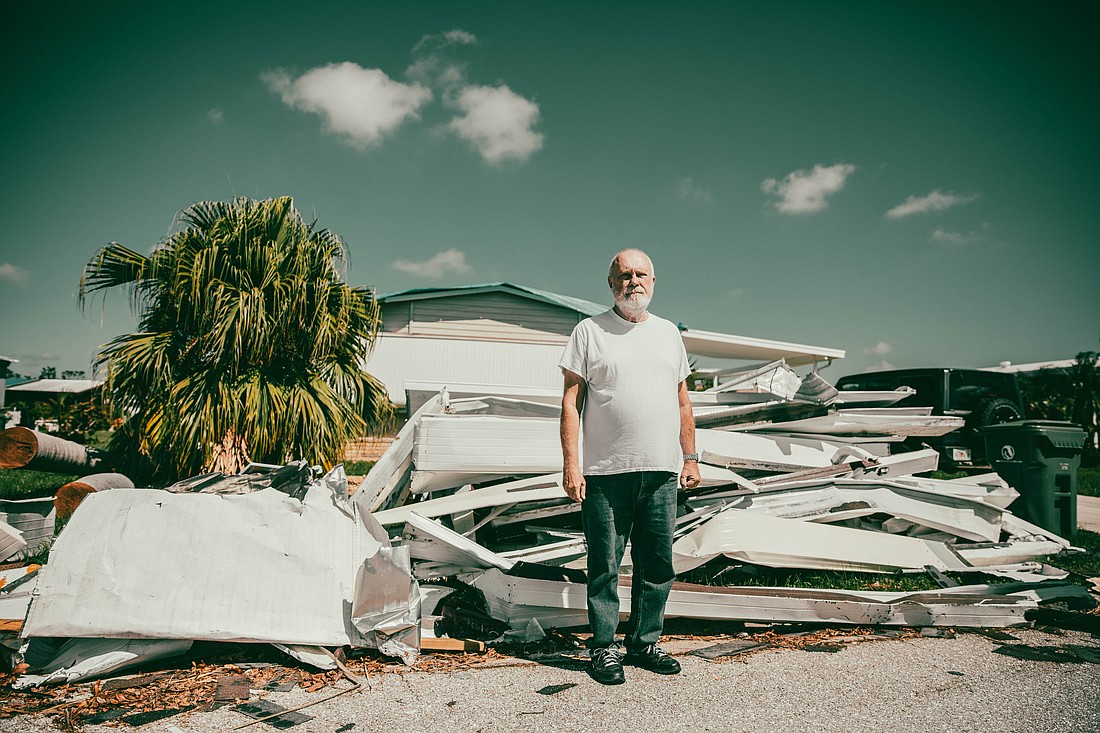 Robert Plunket inspects the aftermath of Hurricane Ian in October 2022.