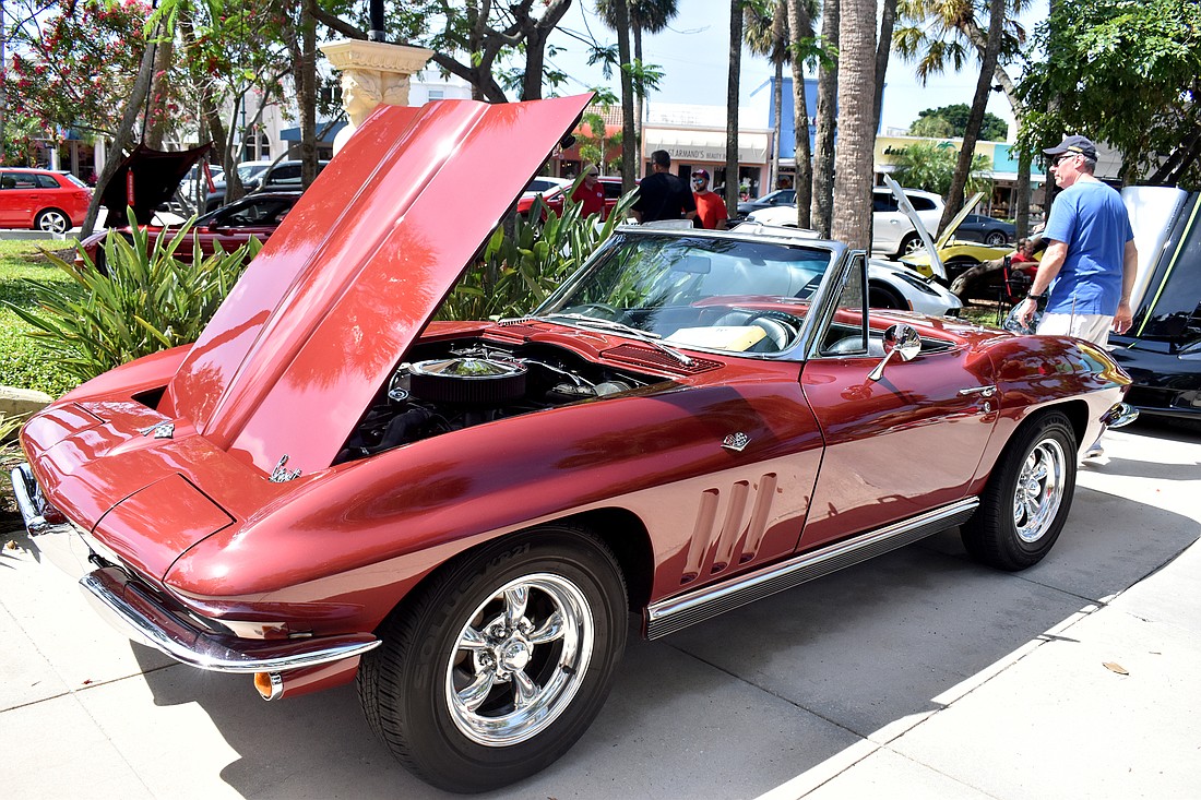 A red Corvette on display at the 2019 Corvettes on the Circle car show at St. Armands Circle.