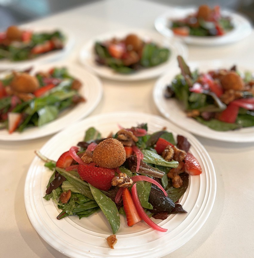 Chef Wu's artisan chèvre salad comprised of mixed greens tossed in a sweet Visalia onion dressing topped with pickled red onions, strawberries, walnuts and a chèvre croquette.