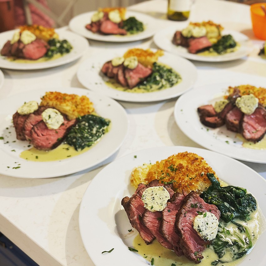 Chef Wu's Sous Vide Filet Mignon topped with compound herb butter served with creamed spinach and potatoes Au Gratin