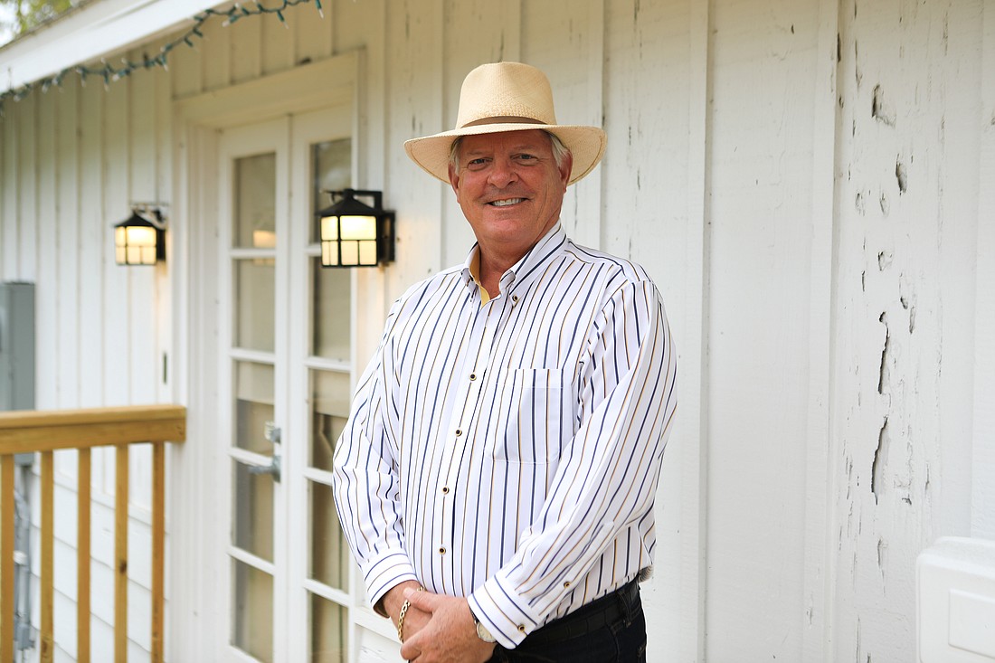Michael Drake, the Longboat Key Historical Society’s president, stands in front of the cottage that now houses the organization’s extensive collection of artifacts.