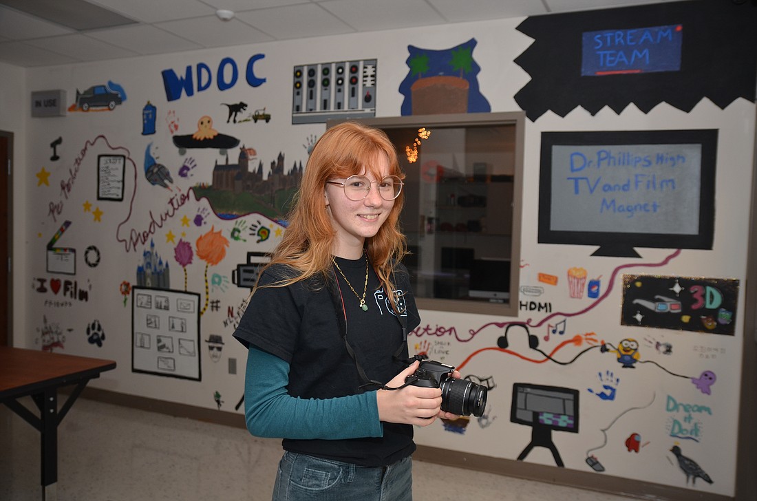 Katerina Carlson won six awards in the film festival at Dr. Phillips High School. Each of her projects was filmed using her DSLR camera. She did all her editing in the room behind her.