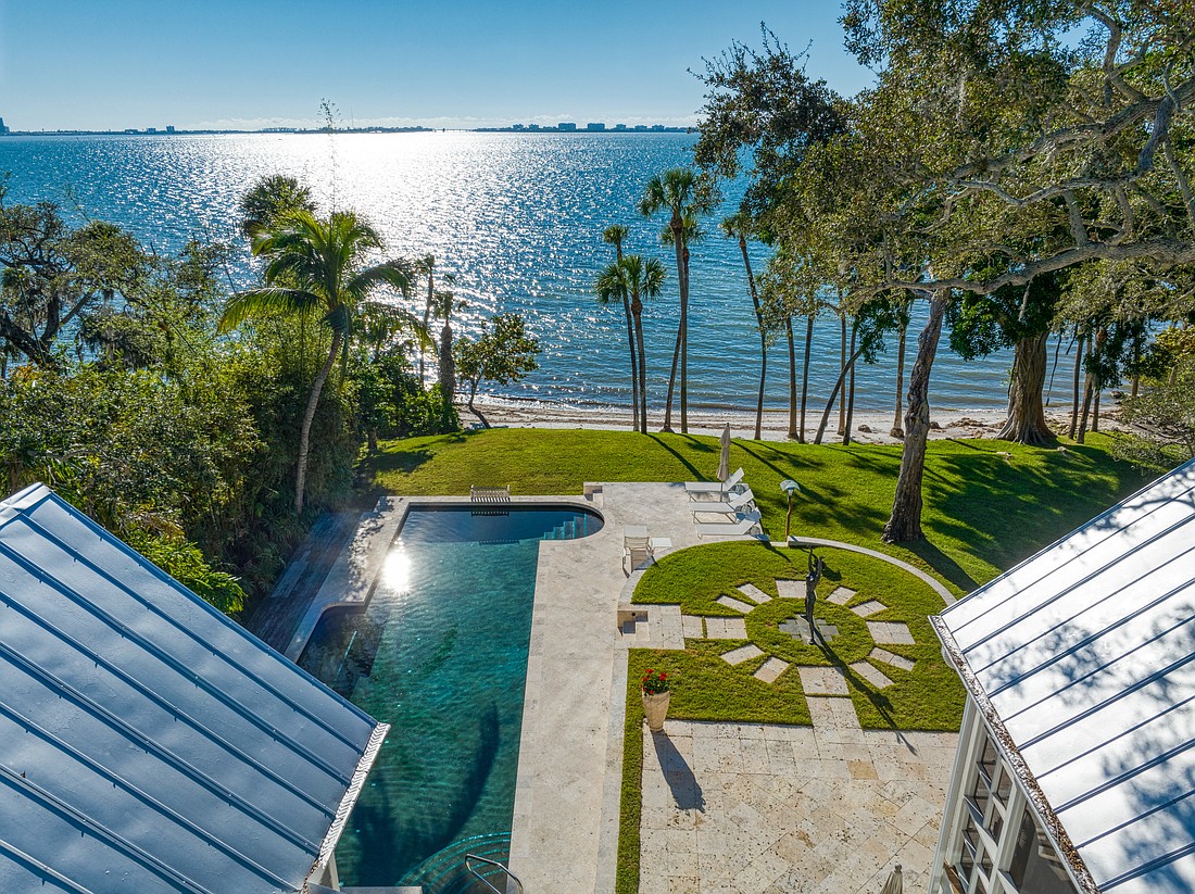 In addition to a pool, 900 Alameda Lane offers 210 feet of private beach on Sarasota Bay.