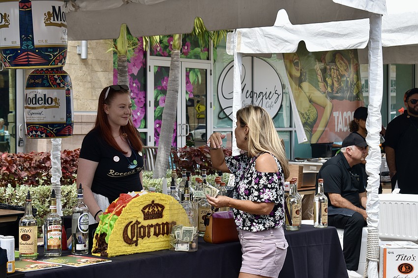 Caitlin Kealey makes a margarita on the rocks for Sarasota's Jennifer Jez.