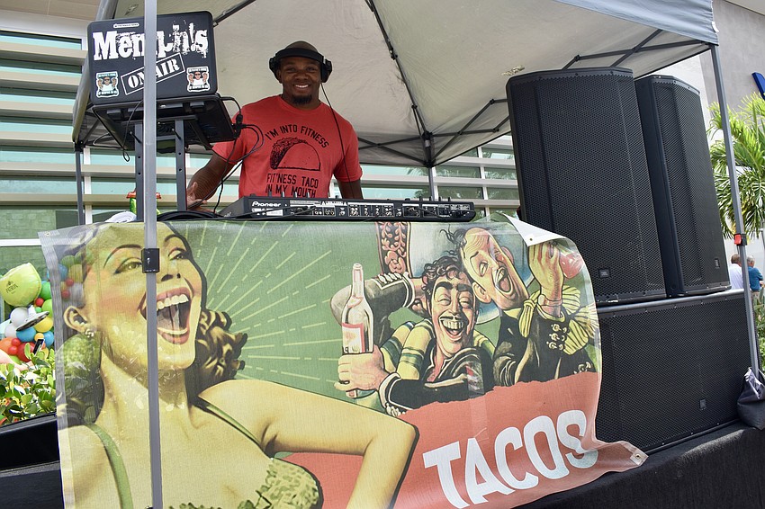 DJ Memphis entertains the crowd outside of Rocco's Tacos for Cinco de Mayo.