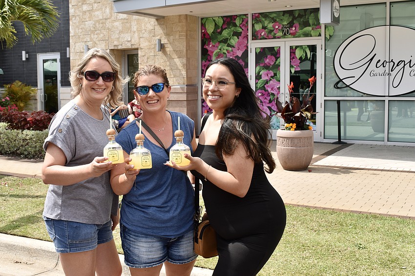 North Port's Ann Carpenter, Venice's Kathy Lefrancois and Sarasota's Diamante Luna enjoy their margaritas at the block party.
