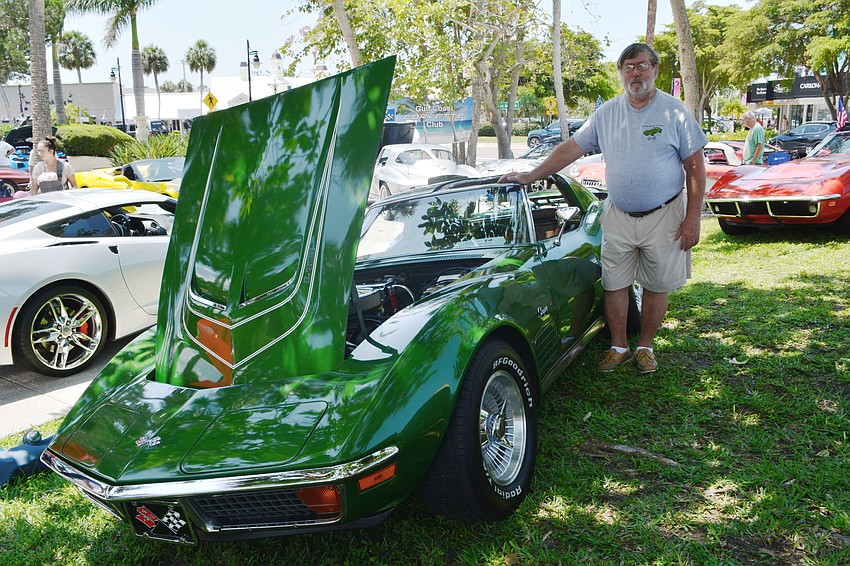 Carl Oberg stands next to his 1972 green coupe which he's owned for 23 years.