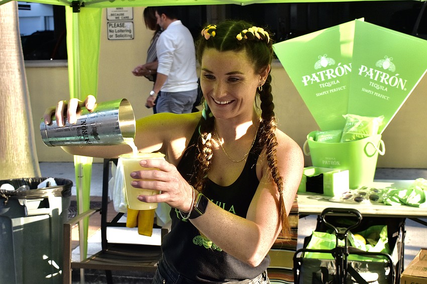 Julia King pours Patrón Tequila at the Circo event.