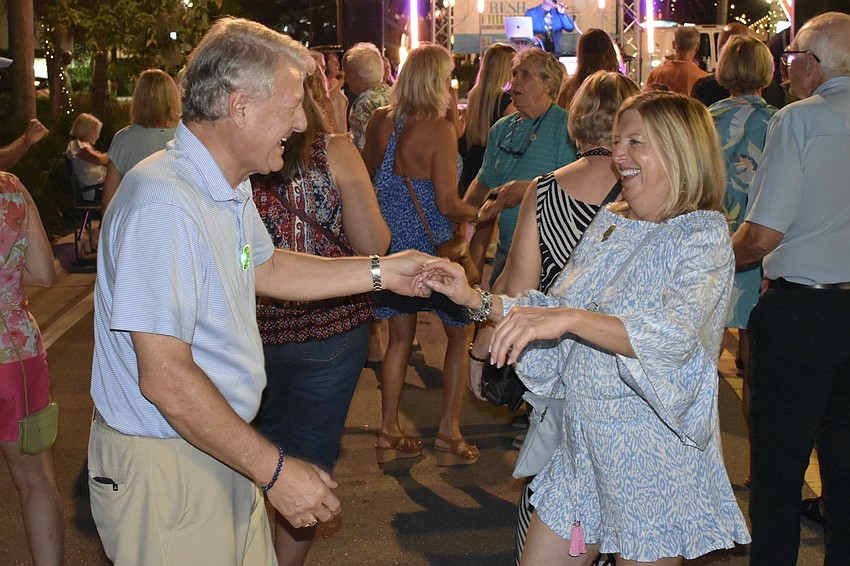 John Scieszinski and Diane Blake dance at the Fresh Fridays event.