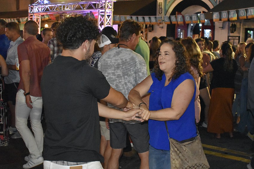 Lissette and Joel Santiano dance at the  El Melvin event