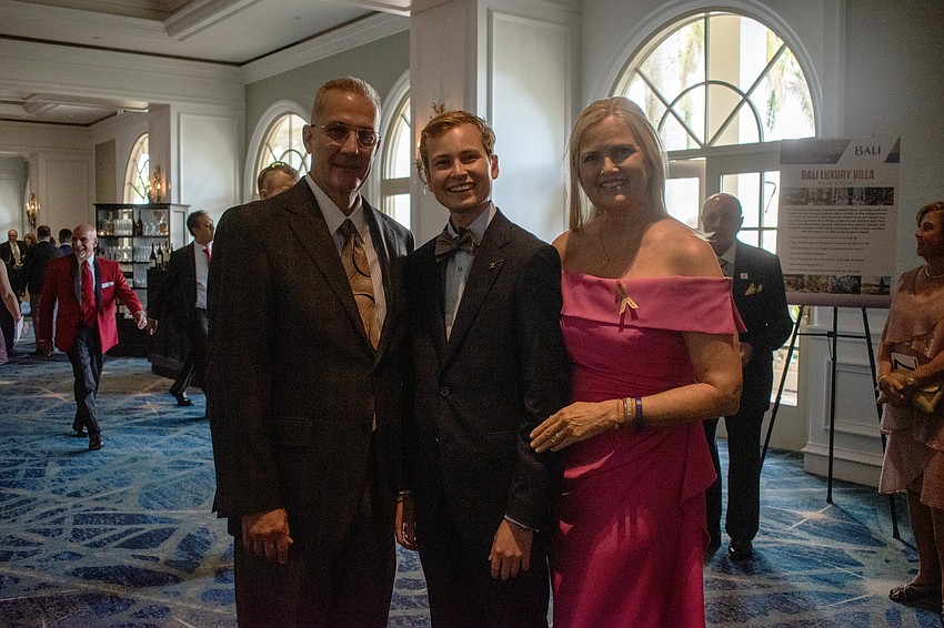 Scott Eicher, Cole Eicher and Laura Eicher. Cole Eicher is part of Dick Vitale's All-Courageous Team.