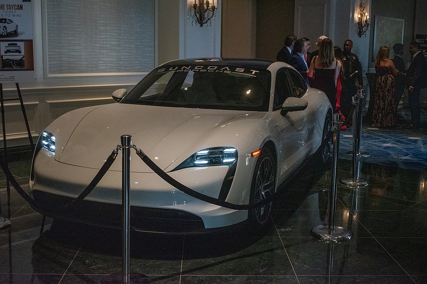 The gala raffled off a 2023 Porsche Taycan as one of its prizes.