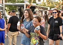 Lakewood Ranch residents Sophia Siegrist and Zoe Hackwelder enjoy ice pops and a laugh.