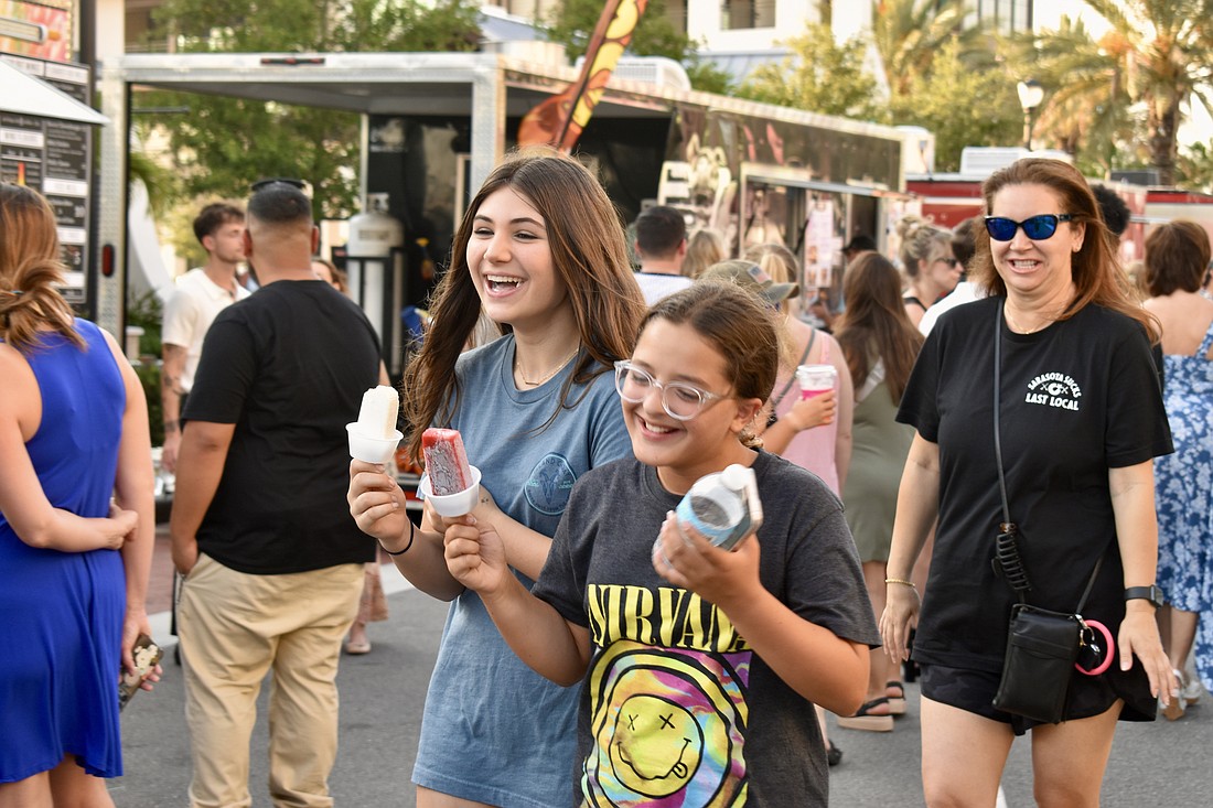 Lakewood Ranch residents Sophia Siegrist and Zoe Hackwelder enjoy ice pops and a laugh.