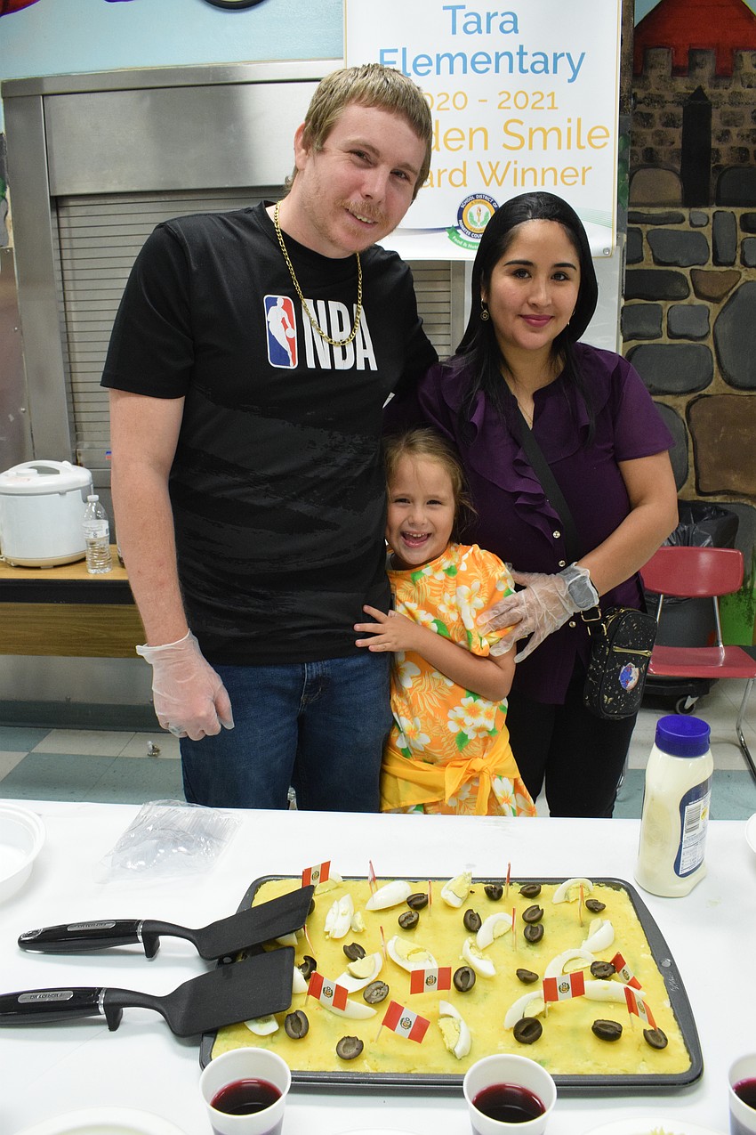 Dustin Long, kindergartner Samantha Long and Fiorella Long make a Peruvian dish for the Banana Leaf Restaurant.