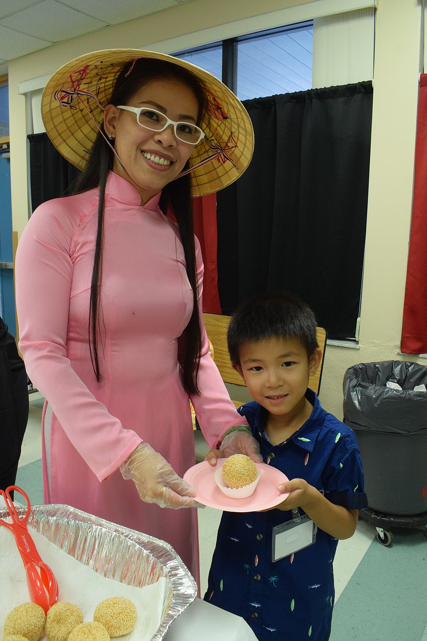 Triot Nguyen makes sesame balls for her son's Brian Nguyen's class and the Banana Leaf Restaurant.