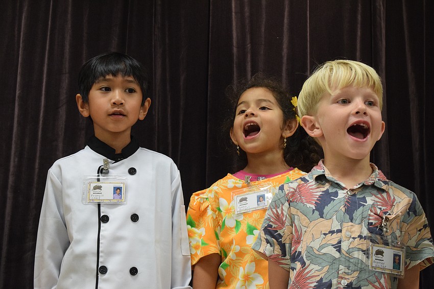 Kindergartners Francis Lantican, Emma Carrillo and Brantley Emmons give it their all during a performance.
