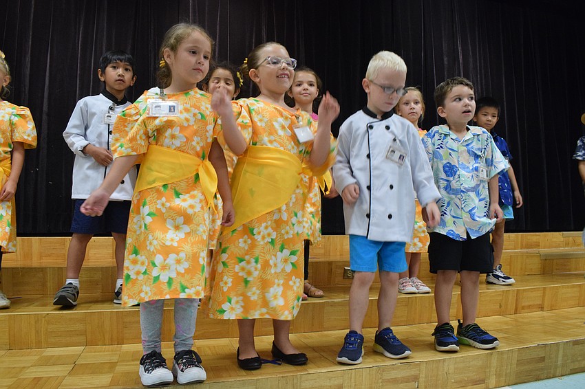 Kindergartners Samantha Long, Eva Marino, Blake Coleman and Jacob Bowman take the lead on a song.