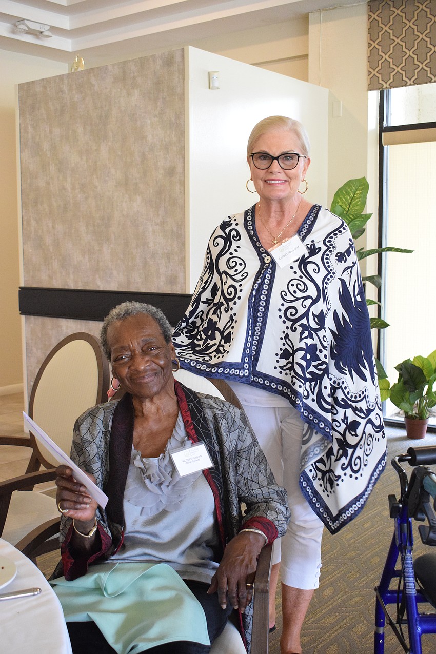 Victoria Brown, the founder of Dollar Dynasty, is grateful to Candace Holloway, a member of the Palm Aire Women's Club, and the rest of the club for their grant. 