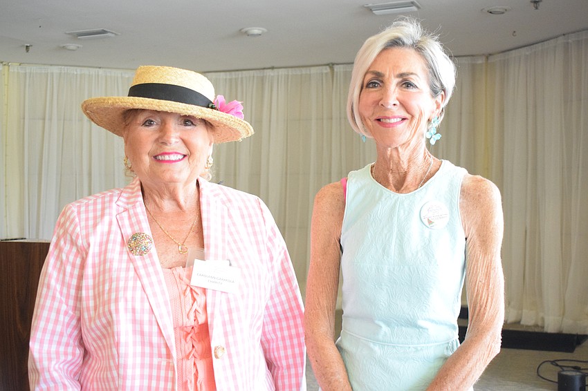 Palm Aire Women's Club's Carolann Garafola presents a grant to Rosemary McMullen, who is a member of Mothers Helping Mothers' advisory board.