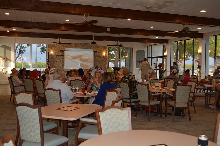Longboat Harbour Condominium residents mingle before the start of the race.