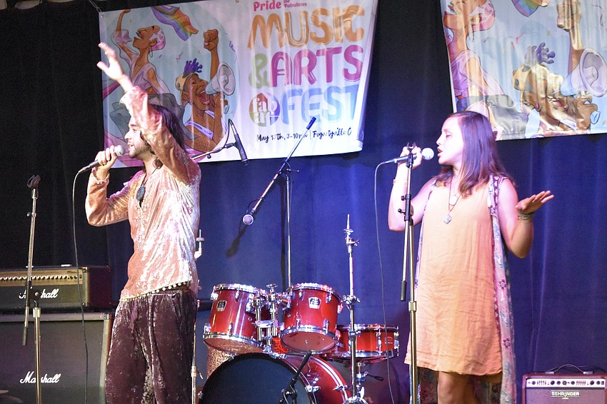 Myles Rodriguez and Sophia Thomson of Myles Optimystic perform.