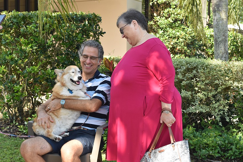 Casey is blessed by Rabbi Brenner Glickman as owner Susy Childers watches.