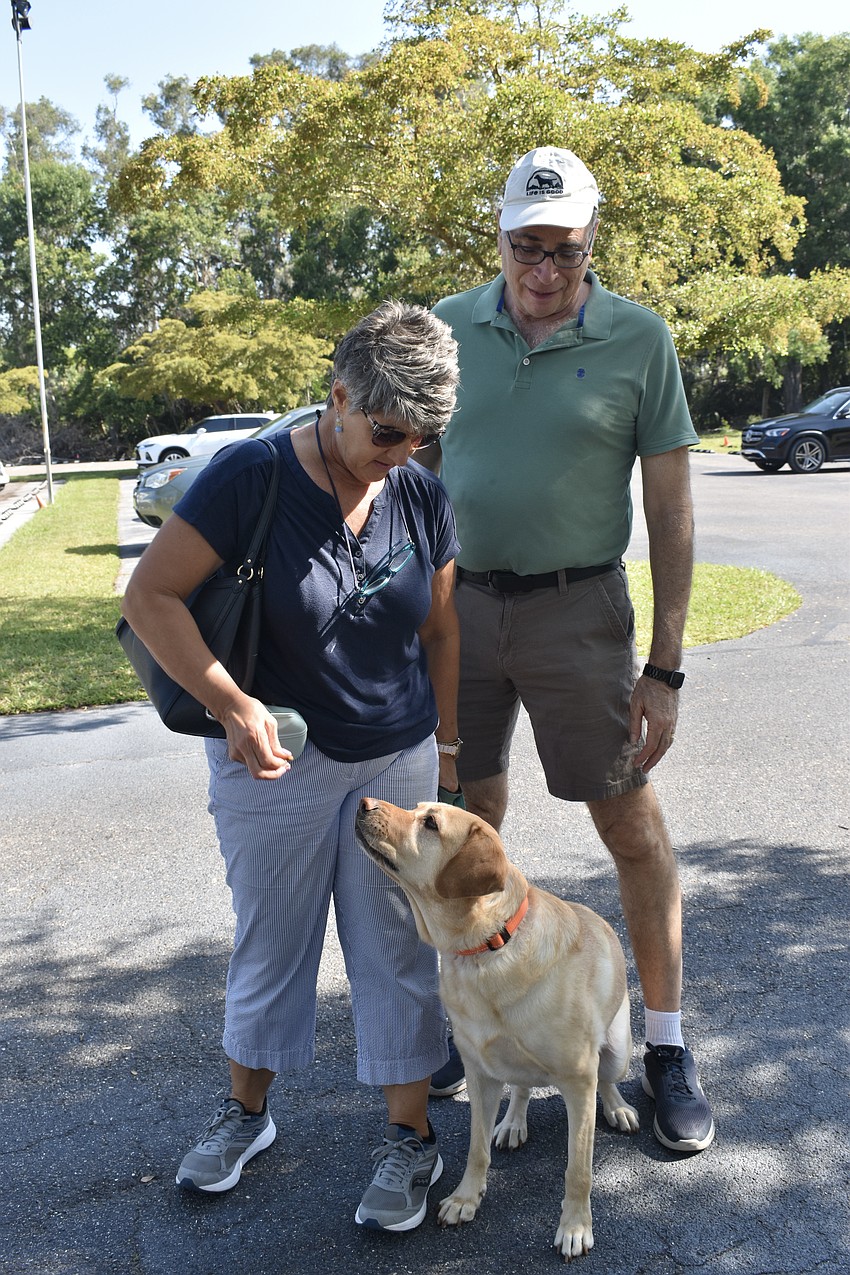 Jeannine Germer, Champ, and Jim Germer wait for their turn.
