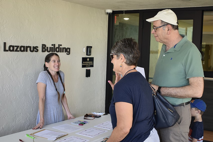 Rabbi Elaine Glickman greets Jeannine and Jim Germer.