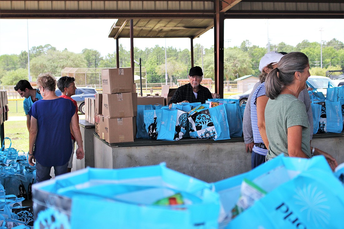 The Flagler Spring Fling Outreach donated 10,000 pounds of food to over 90 families. Photo courtesy of Flagler County.