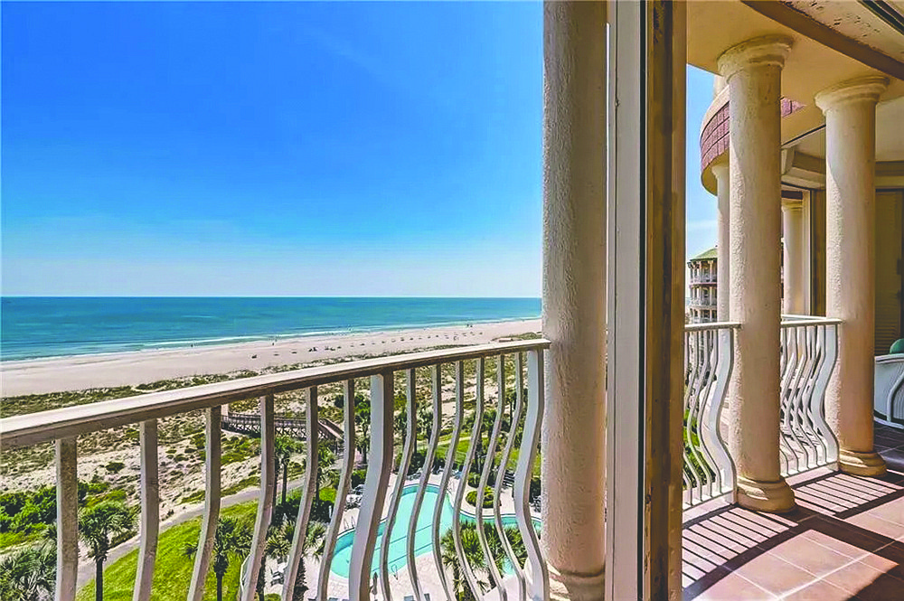 Oceanfront condo with golf course views features three bedrooms, three full and two half-bathrooms and two underground parking spaces.