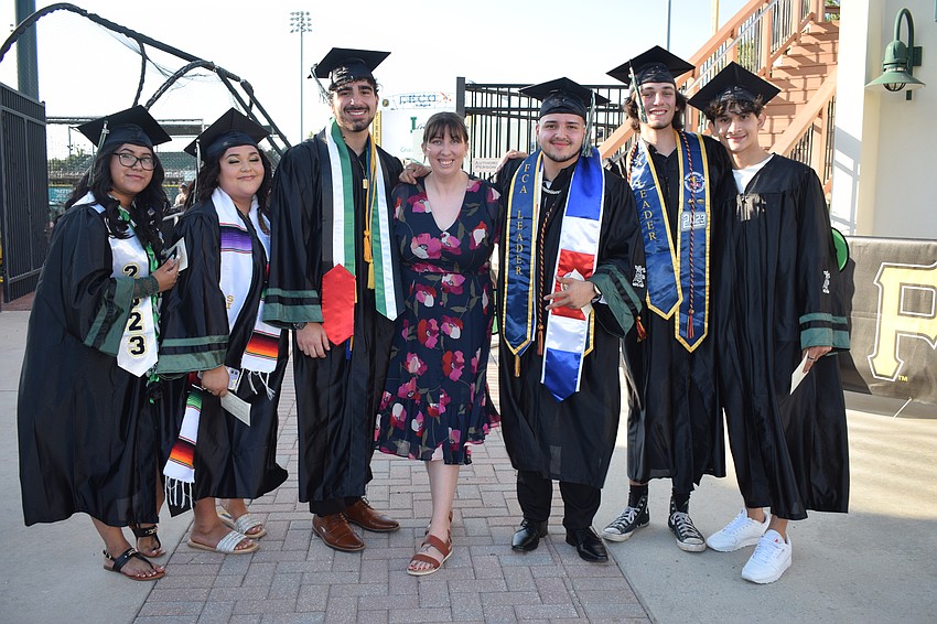 Lakewood Ranch High School's Irene Yixel Salmeron-Antonio, Jaylynn Sanchez, Omar Raba, John Wyatt, Logan Reynolds and Landon Llamas are excited to celebrate their graduation with Kelly Smith-Williams, a teacher (center).