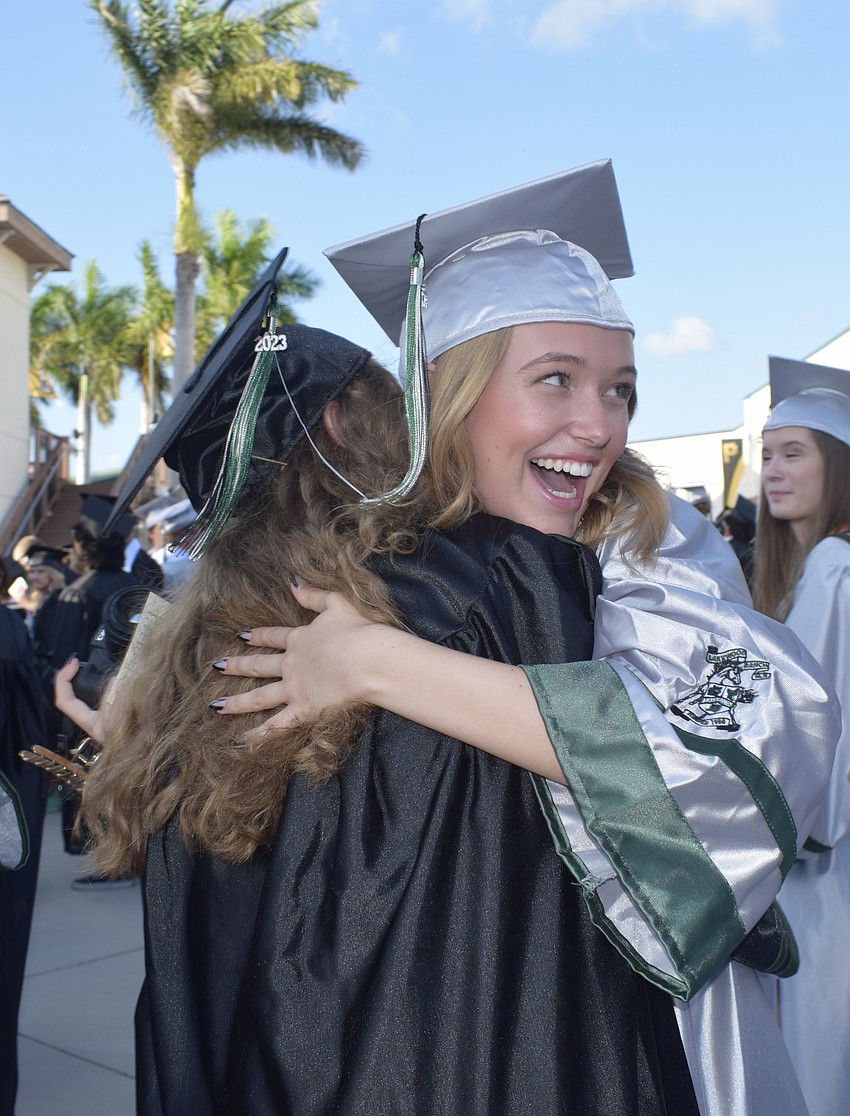 Lakewood Ranch High's Linsey Beatenhead hugs Madilyn Gemme.