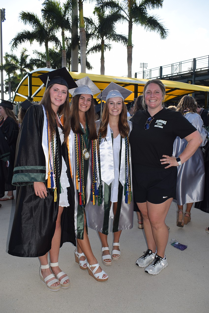 Lakewood Ranch High School's Joslyn Chapman, Samantha Rees and Morgan McCabe are thankful for teacher Sammy Biggs.