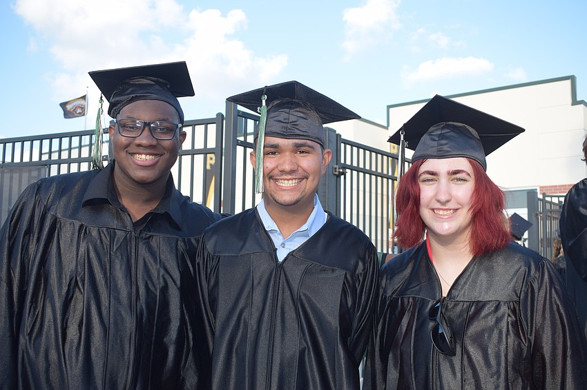 Lakewood Ranch High School's Mark Tarver, Nelson Rivera and Jasper Middlebrook prepare for their graduation ceremony. Rivera says he had butterflies in his stomach.