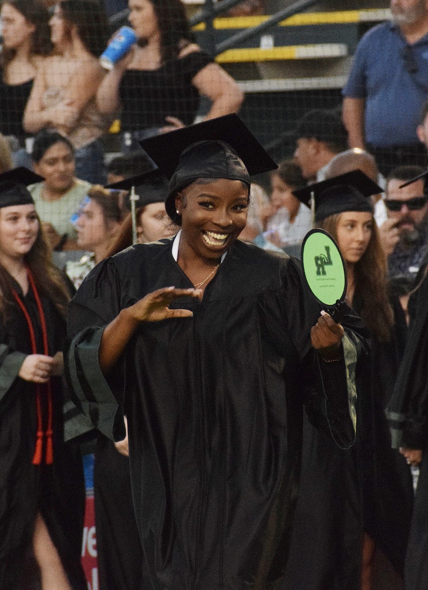 Lakewood Ranch High School's Ja'miya Ford celebrates as she walks to get her diploma.