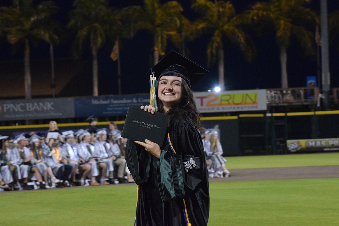 Lakewood Ranch High School's Sienna Zwizinski shows off her diploma.