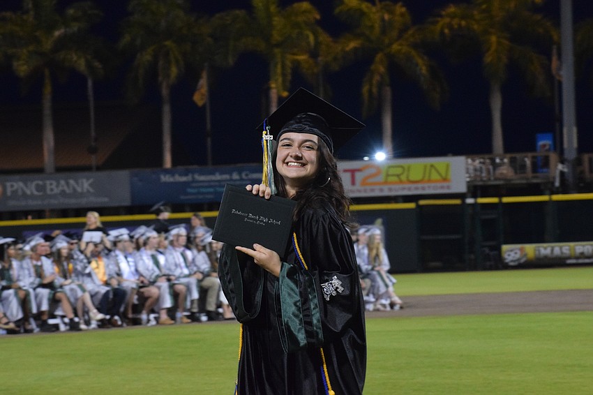 Lakewood Ranch High School's Sienna Zwizinski shows off her diploma.