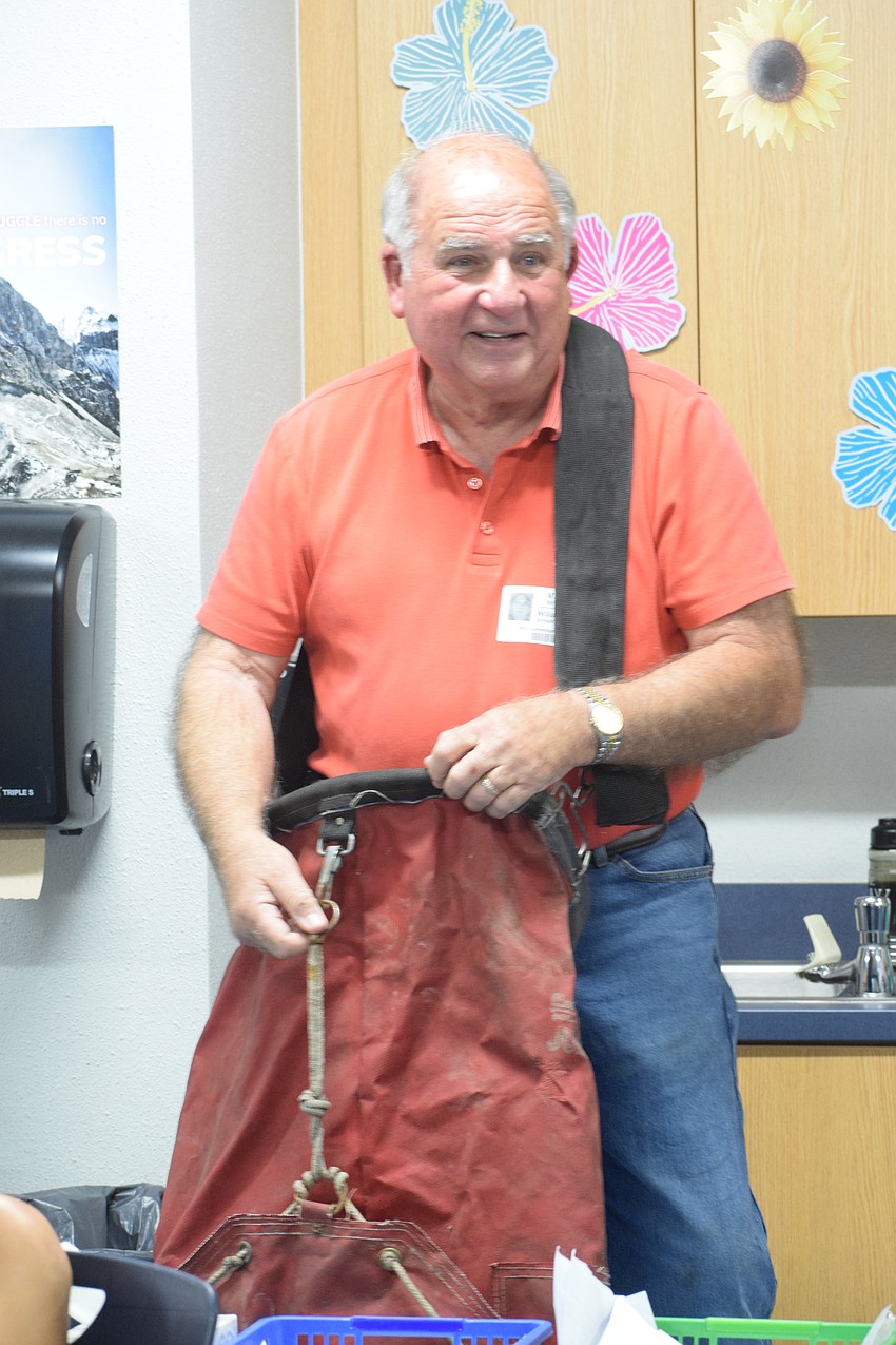 Dean Mixon, who owns Mixon Fruit Farms, explains how citrus fruits are collected.