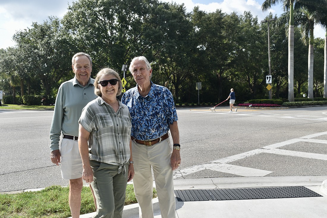 Tara Preserve residents Peyton Phillips, Marian Murdoch and Darby Connor at the intersection of Tara Boulevard and Tara Preserve Lane. Residents have been rallying for a four-way stop here since 2017.