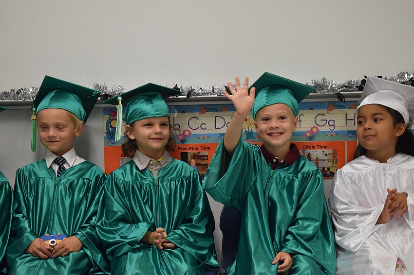 Mini Mustangs' Rowan Riedl, Michael Bess, Mason Gogoel and Leanne Delcid look for their families in the audience.