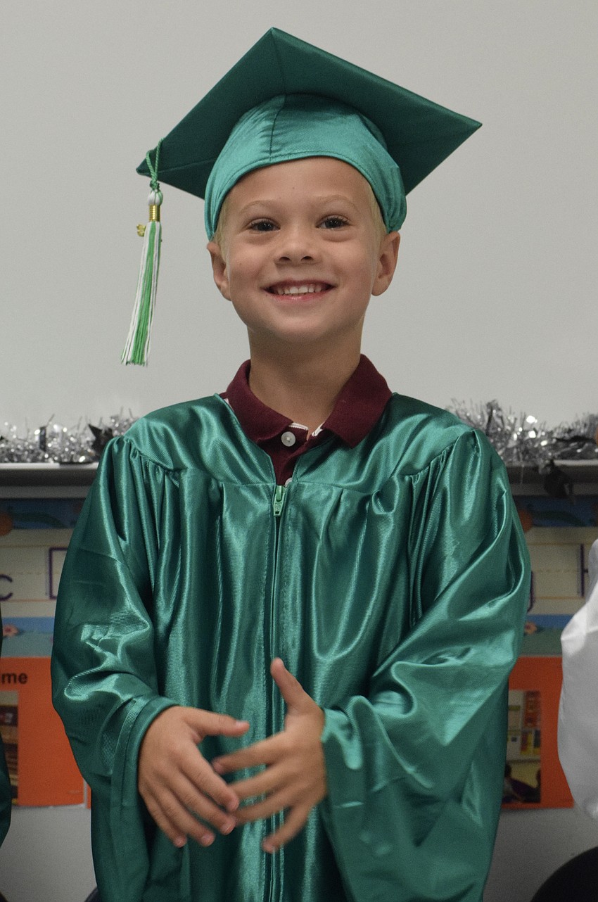 Mini Mustangs' Mason Gogoel has fun performing with his classmates.