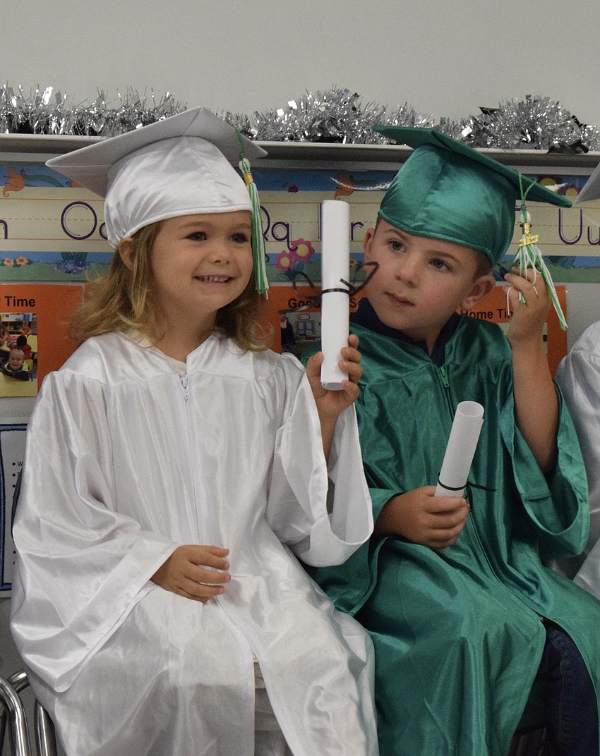 Mini Mustangs' Kaylie Field and Jack Wright can't wait to show their diplomas to their families.