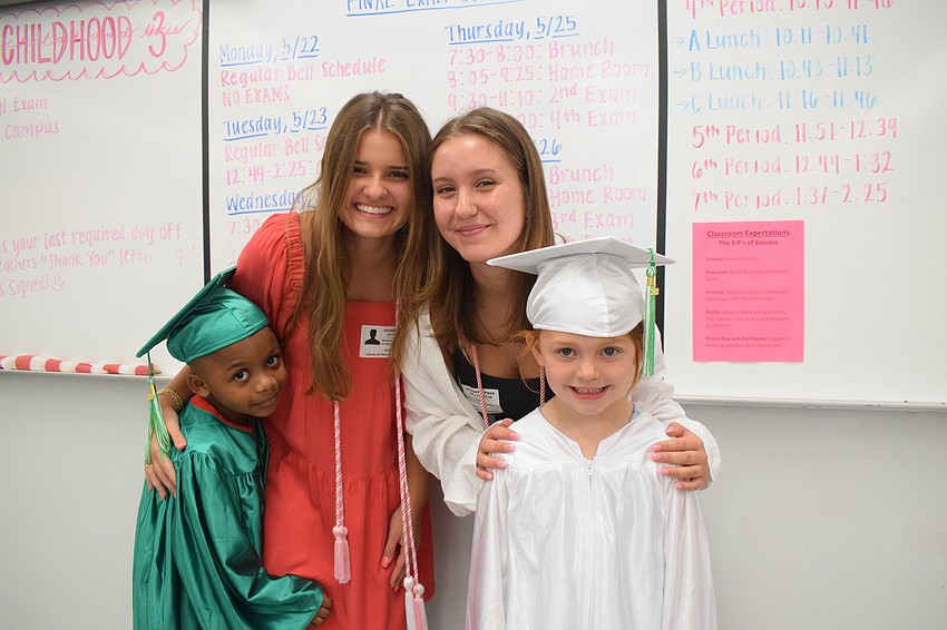 Mini Mustangs' Amir Phillips, Lakewood Ranch High School seniors Britlee Yant and Grace Kelly and Mini Mustangs' Savannah Cato celebrate as both the Mini Mustangs and the seniors are graduating on the same day.