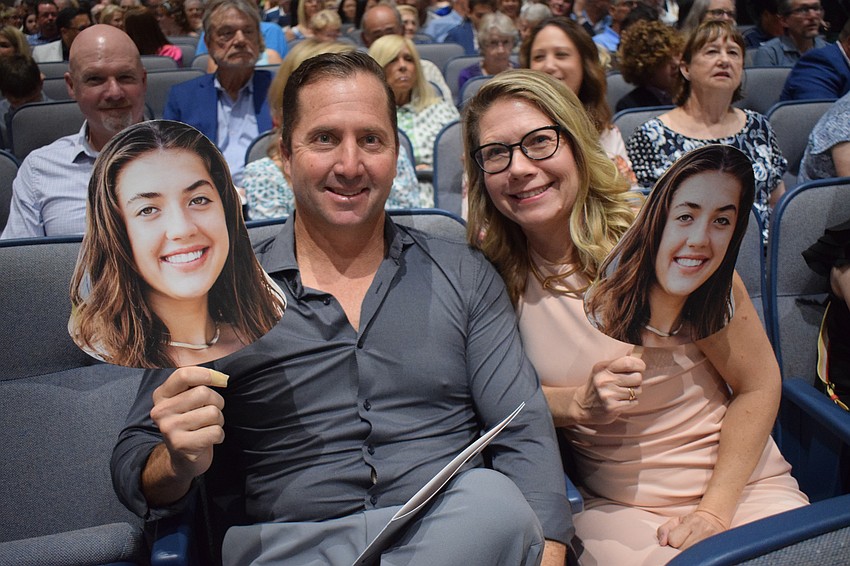 Tony and Courtney Bonacuse have cutouts made of Out-of-Door Academy's Emma Bonacuse.