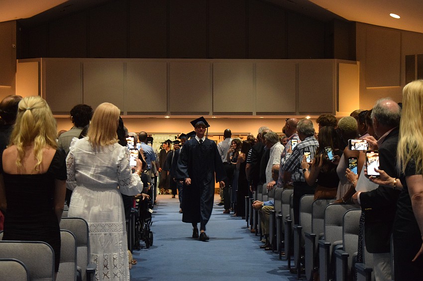 Families watch as the Out-of-Door Academy graduates make their way to their seats.