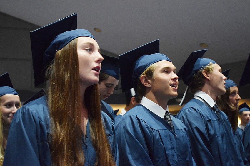 Out-of-Door Academy's Sara Green and Giovanni Giuliani sing along to the school's alma mater.