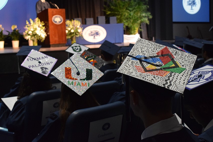 Out-of-Door Academy graduates decorate their caps to represent where they are headed after graduation or to express a passion.