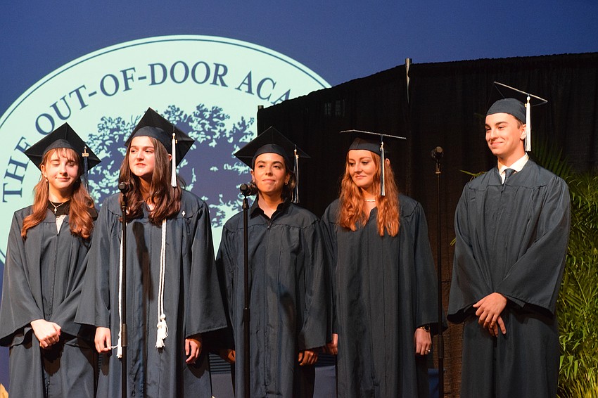 Out-of-Door Academy's Olivia Millin, Natalie Carrión, Svetlana Kondratovich, Kaylee Shockey and Johnny Robinson sing together at the graduation ceremony.